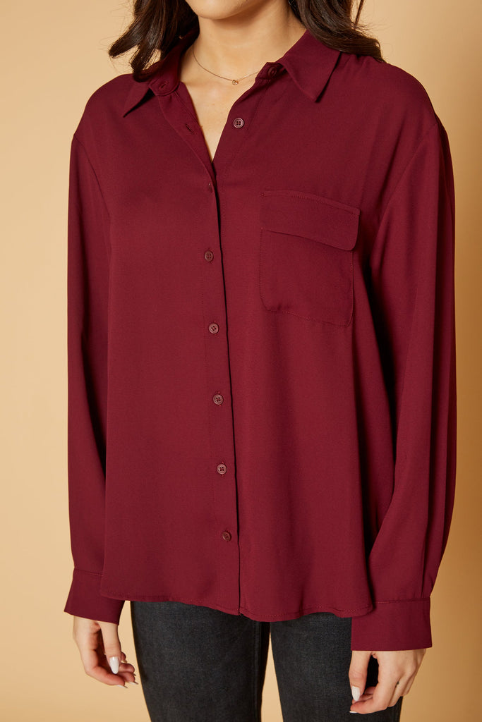 Pleione Women's Solid Low Back Button Shirt in Burgundy
