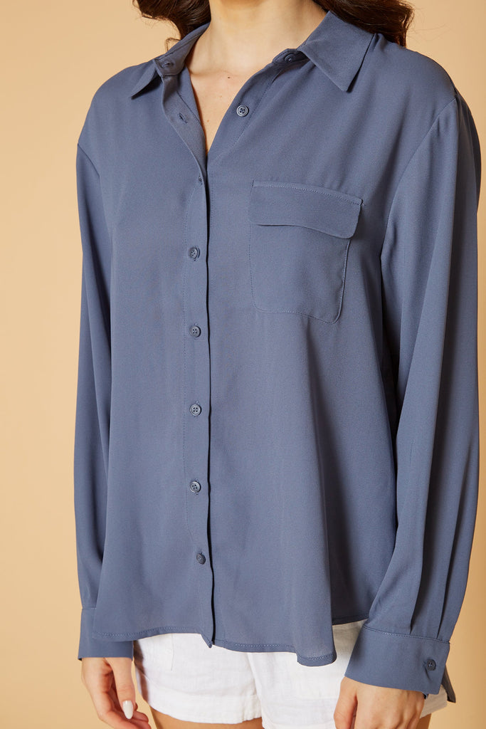 Pleione Women's Solid Low Back Button Shirt in Dusty Blue