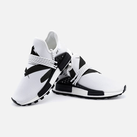 A pair of white sneakers with black accents, featuring a lace-up closure and a high quality EVA sole.